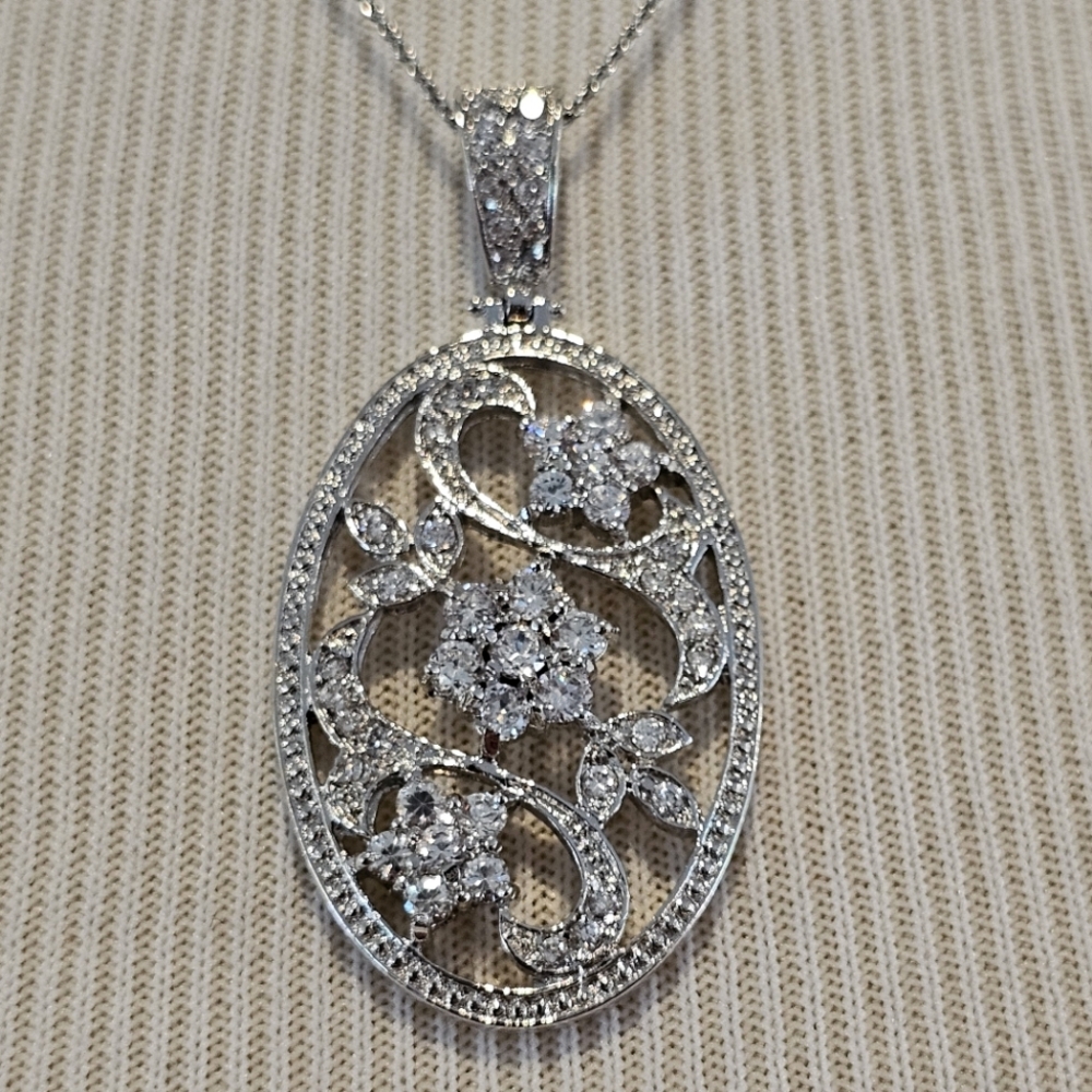 Sterling silver oval pendant w/ CZ flowers and leaves on sterling chain